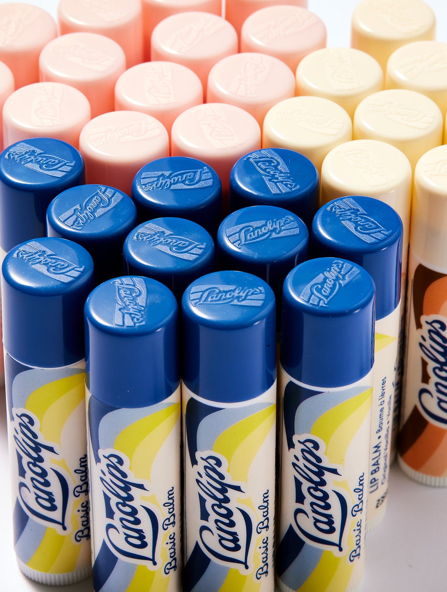 Collection of Lanolips Basic Balms in the natural flavours of Original Vanilla, Coconutter and Strawberry.