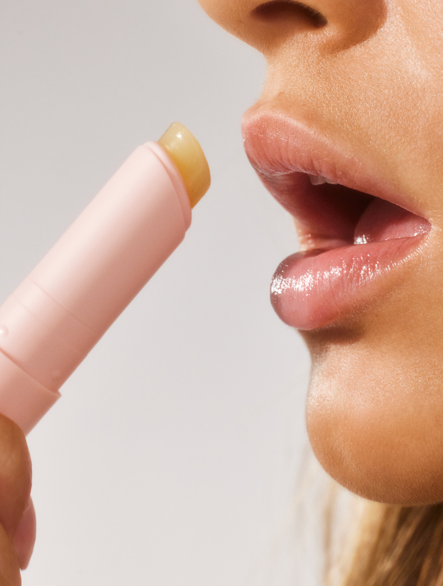 Close-up shot of model applying The Original Lanostick