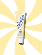 Load image into Gallery viewer, Lifestyle shot of Lanolips 101 Ointment Multi Balm Vanilla. A super rich balm that seals in moisture to give extreme hydration for extremely dry &amp; chapped lips, skin patches, cuticles, elbows &amp; more.
