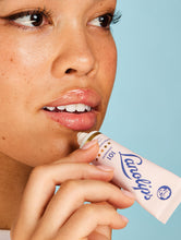 Load image into Gallery viewer, Close up shot of a model applying the Lanolips Original 101 Ointment on her lips. Made with 100% ultra pure grade Aussie lanolin, the Original 101 Ointment provides intense moisture, perfect for dry and chapped lips.

