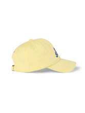 Load image into Gallery viewer, Lanolips Go Bananas Yellow Cap side view. 
