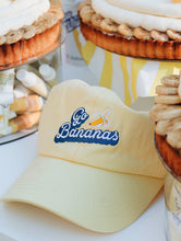 Load image into Gallery viewer, Lifestyle shot of the 101 Delicious Go Bananas baseball style cap.
