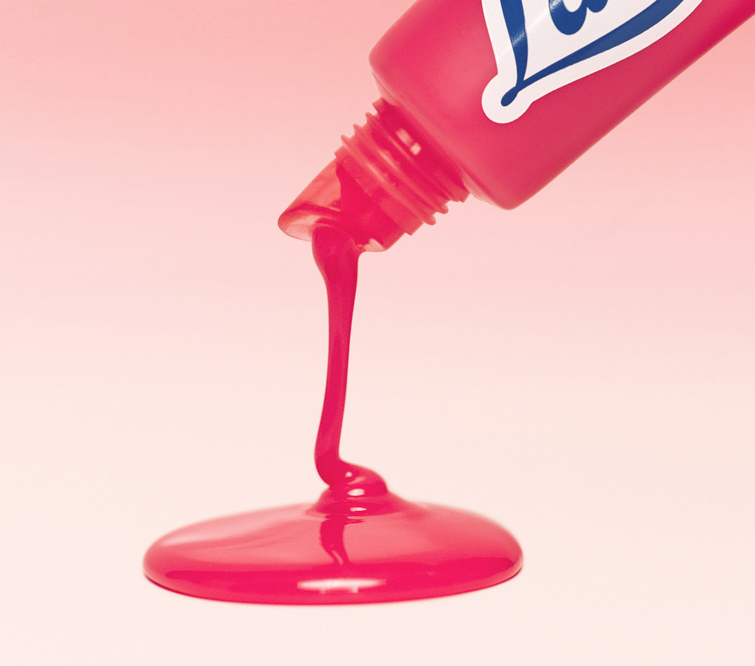 Macro close-up of Lanolips Milkshake Ceramide Balm in Raspberry Crumble, showing rich, glossy balm texture on applicator tip