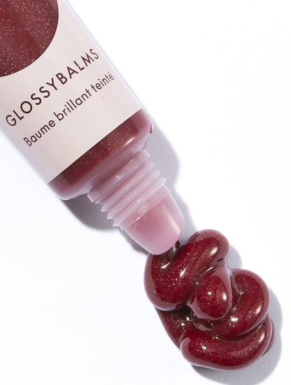 Lanolips glossybalm berry tube with product swatch.