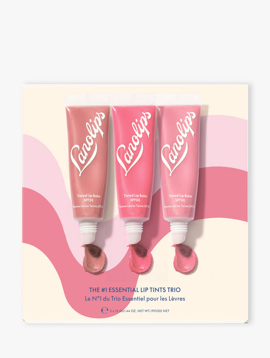 Product shot of the Lanolips The #1 Essentials Lip Tints Trio packaging on beige background. The set contains our three best-selling shades: Perfect Nude, Rhubarb and Rose. 