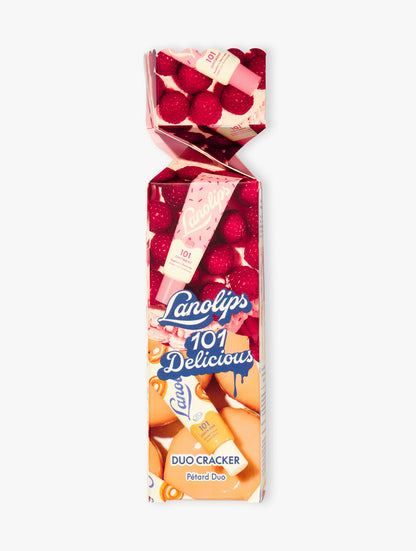 Product shot of the Lanollips 101 Delicious Holiday Cracker. The duo contains our best selling Glazed Donut and Raspberry Shortcake. Made with rich lanolin, vitamin-E and natural flavours for the ultimate hydration.