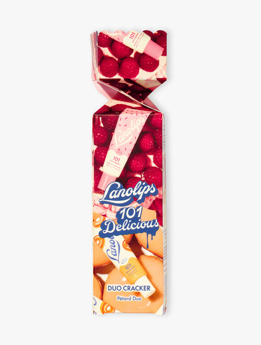 Product shot of the Lanollips 101 Delicious Holiday Cracker. The duo contains our best selling Glazed Donut and Raspberry Shortcake. Made with rich lanolin, vitamin-E and natural flavours for the ultimate hydration.
