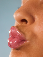 Load image into Gallery viewer, Close up shot of model wearing Lanolips Liquid Lip Water

